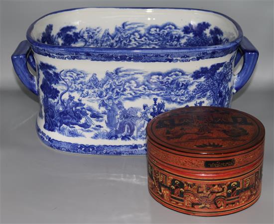 A blue and white footbath and a lacquer box